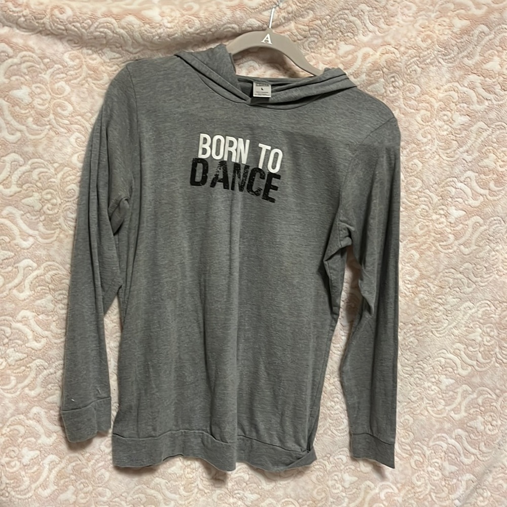 Comfortable gray sweatshirt with the wording born to dance great for dancers